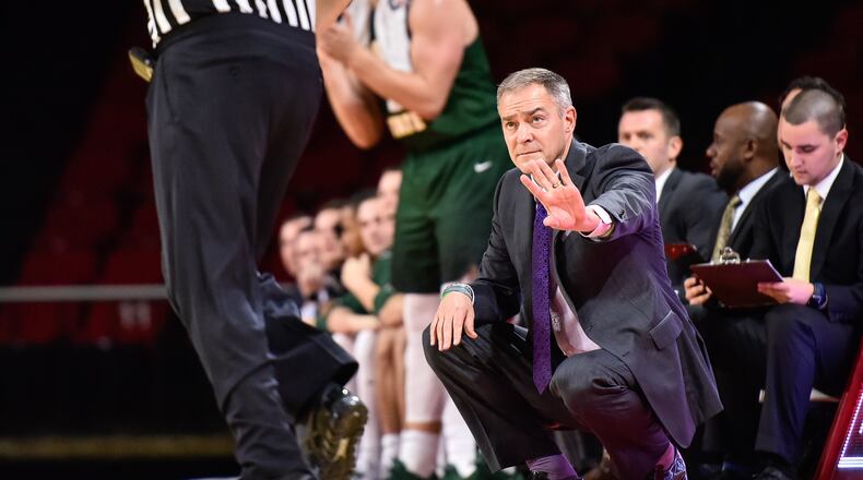 Wright State University head men’s basketball coach Scott Nagy kneels by the court during their game against Miami University Tuesday, Nov. 14 at Millett Hall in Oxford. The Miami University Redhawks basketball team defeated the Wright State Raiders 73-67 in overtime. NICK GRAHAM/STAFF