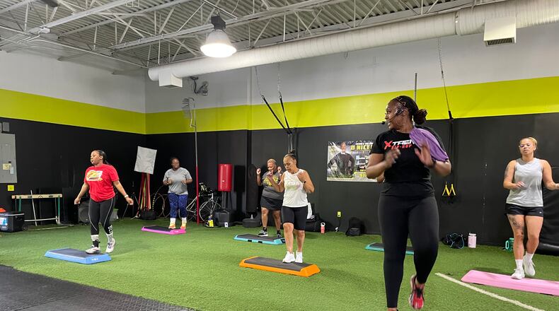 Courtney Ely, who owns CME Sweat Fitness, teaches Xtreme Hip-Hop step classes at DNSFit Studio, 4616 Salem Ave. in Trotwood. NATALIE JONES/STAFF
