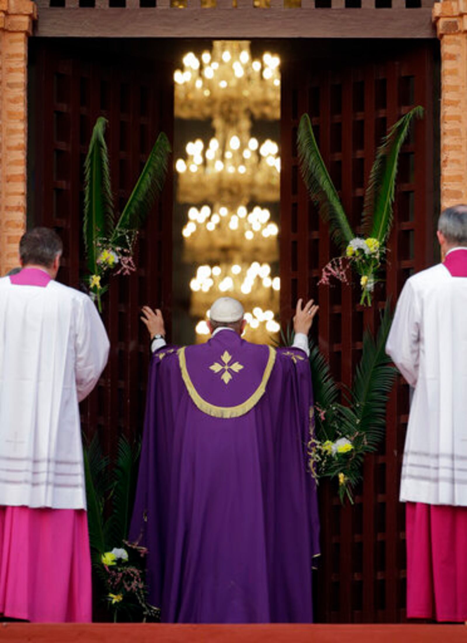 FILE - Pope Francis opens the holy door of the Bangui cathedral, Central African Republic, Sunday, Nov. 29, 2015. (AP Photo/Andrew Medichini, file)