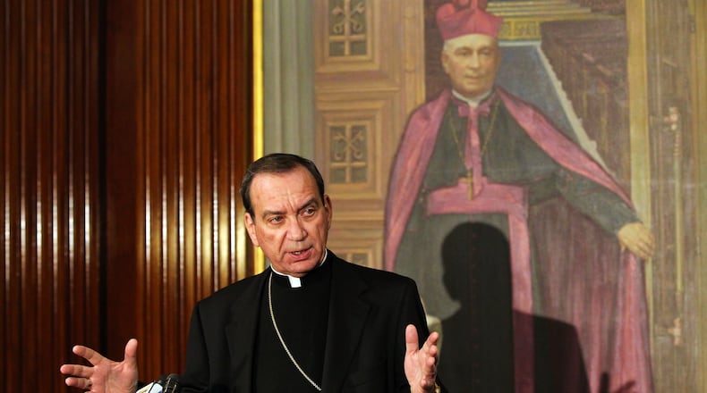 Cincinnati Archbishop Dennis M. Schnurr at a 2013 press conference. NICK DAGGY / STAFF