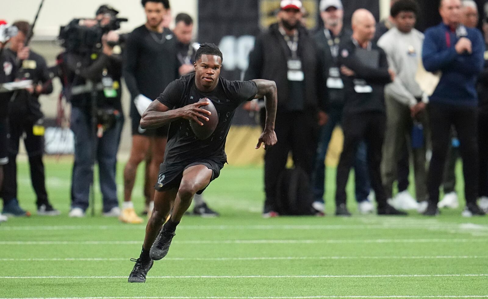Colorado wide receiver Travis Hunter takes part in passing drills during the team's NFL football pro day Friday, April 4, 2025, in Boulder, Colo. (AP Photo/David Zalubowski)