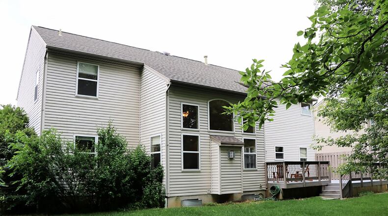 Patio doors off the breakfast room open to the composite deck and fenced back yard, which includes a storage shed and a separate brick sun patio.
