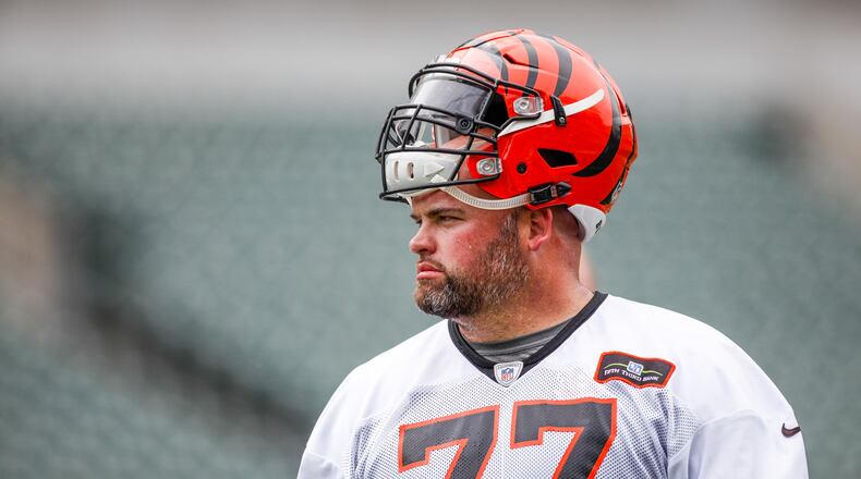 Cincinnati Bengals offensive tackle Andrew Whitworth watches from the sidelines during a break on the first day of mandatory mini camp Tuesday, June 14 at Paul Brown Stadium in Cincinnati. NICK GRAHAM/STAFF