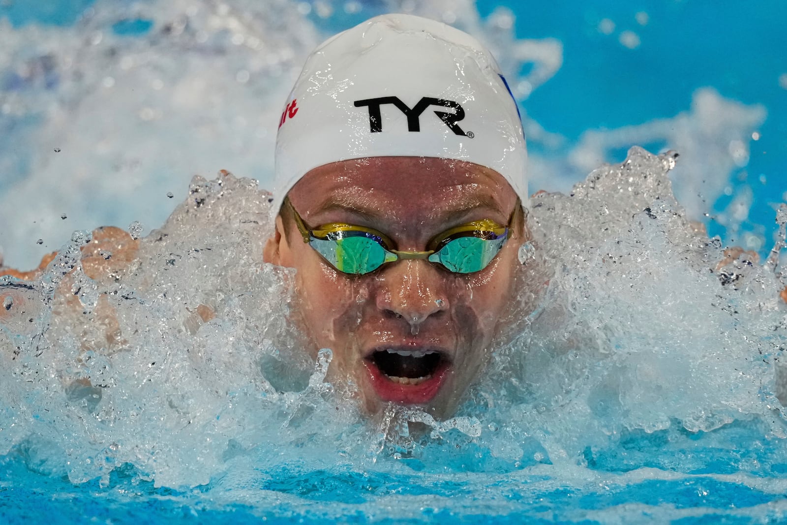 Leon Marchand of France competes in the men's 200-meter individual medley semifinals at the World Aquatics Championships in Singapore, Wednesday, July 30, 2025. (AP Photo/Vincent Thian)