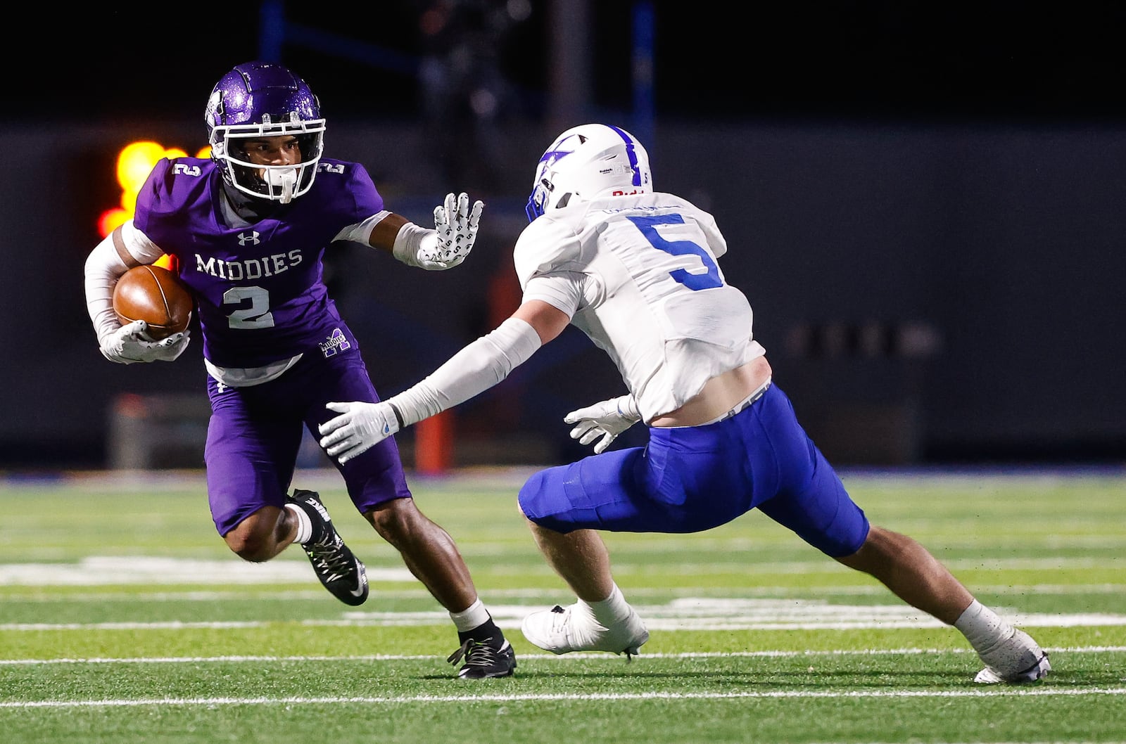 Middletown's Ace Cooper avoids a tackle by St. Xavier's Jake Britt during their Division I State semifinal football game Friday, Nov. 28, 2025 at Welcome Stadium in Dayton. The Bombers won 21-6. NICK GRAHAM/STAFF