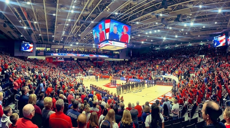 Dayton and Lindenwood stand for the national anthem before their game on Monday, Nov. 7, 2022, at UD Arena. David Jablonski/Staff