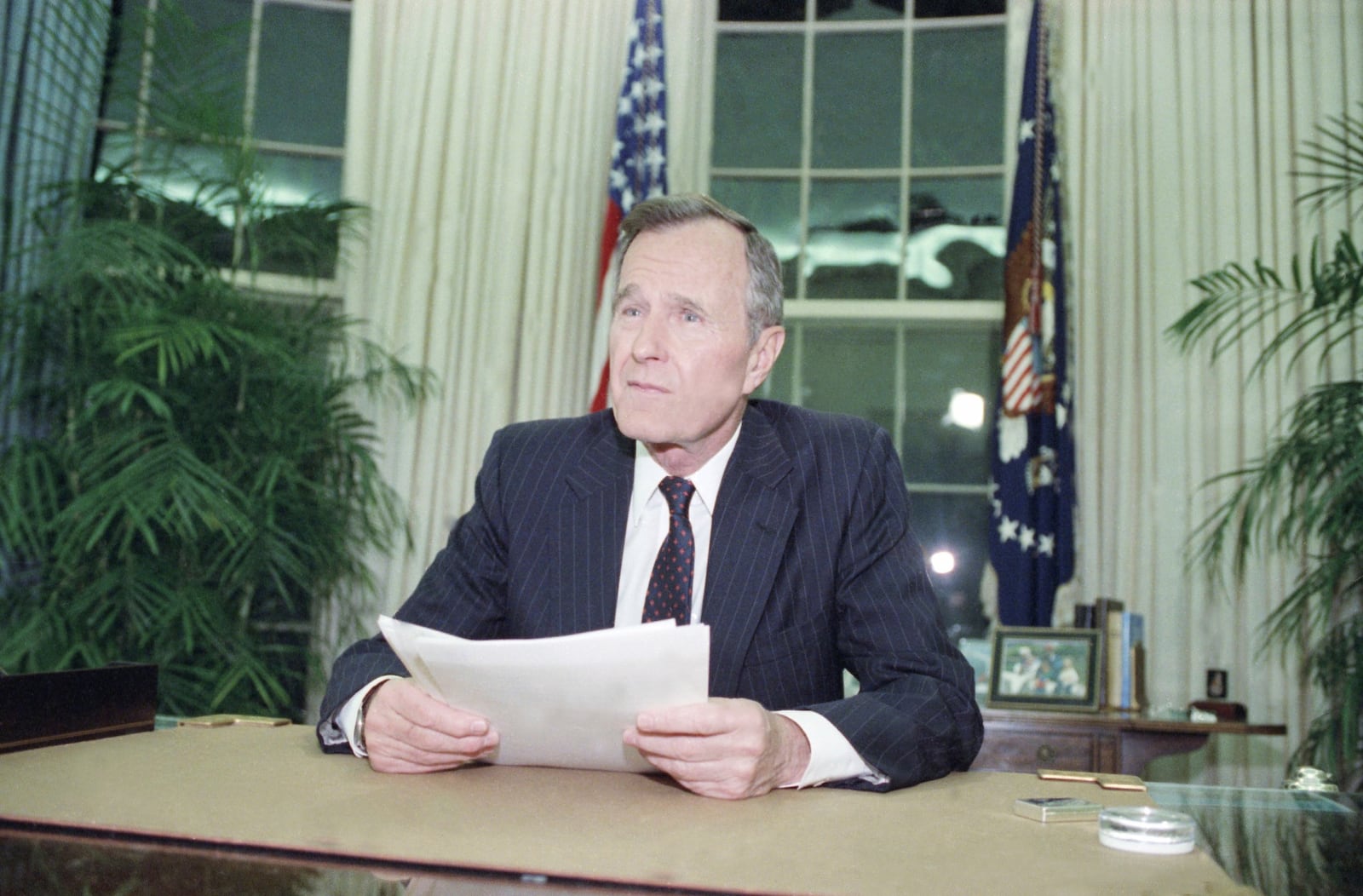 FILE - President George H.W. Bush addresses the nation on May 1, 1992, from the Oval Office in Washington. (AP Photo/Dennis Cook, File)