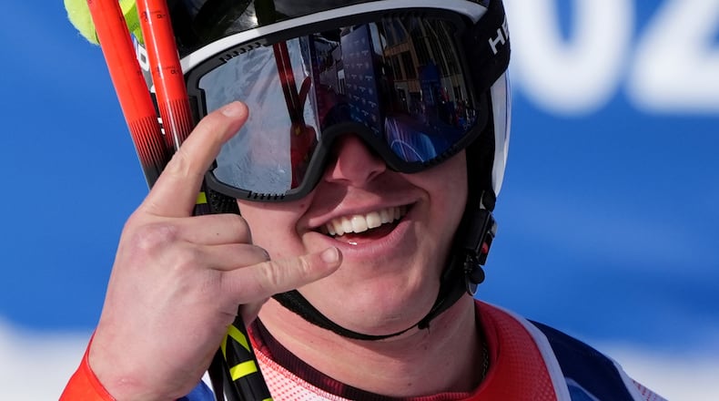 Switzerland's Franjo von Allmen celebrates at the finish area of an alpine ski men's downhill race, at the 2026 Winter Olympics, in Bormio, Italy, Saturday, Feb. 7, 2026. (AP Photo/Rebecca Blackwell)