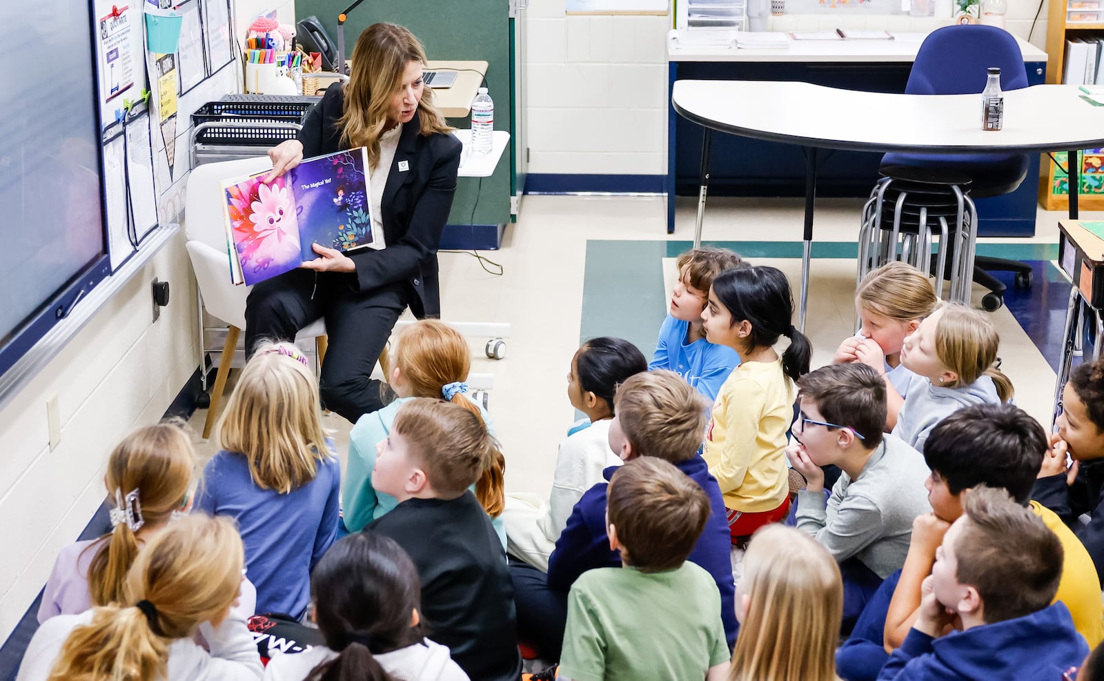 Democrat Ohio gubernatorial candidate Amy Acton reads a book to Monroe Elementary School students Wednesday, Jan. 14, 2026 in Monroe. She visited classrooms and spoke with students, teachers and leadership during the tour. NICK GRAHAM/STAFF