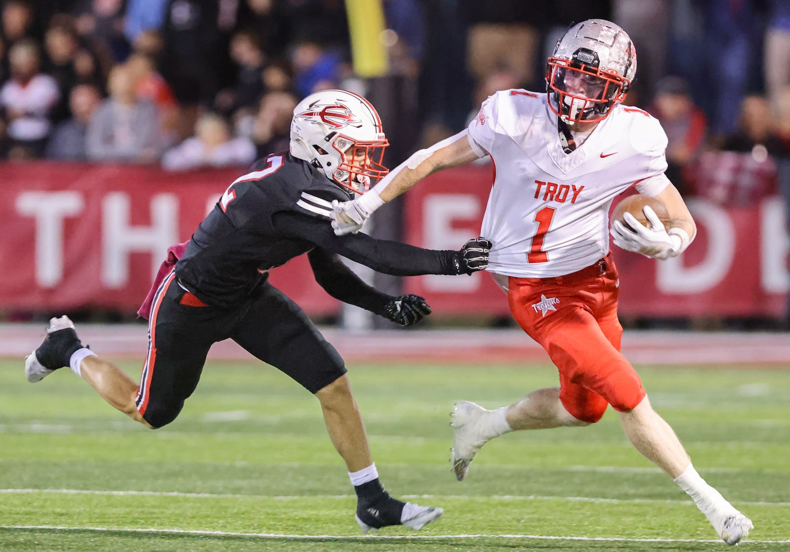 Troy senior halfback Aidan Gorman tries to fight off Tippecanoe's Max Deckard during the first quarter of a Miami Valley League game on Friday, Oct. 17 at Tipp City Park. Tippecanoe won 21-0 to hand Troy its first shutout loss since Week 3 of 2022. BRYANT BILLING / STAFF