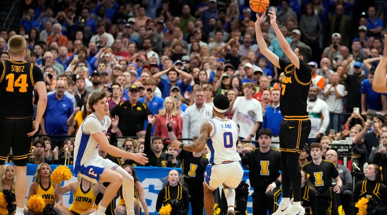 Iowa forward Alvaro Folgueiras (7) puts up a three point shot against Florida during the second half in the second round of the NCAA college basketball tournament Sunday, March 22, 2026, in Tampa, Fla. (AP Photo/Chris O'Meara)