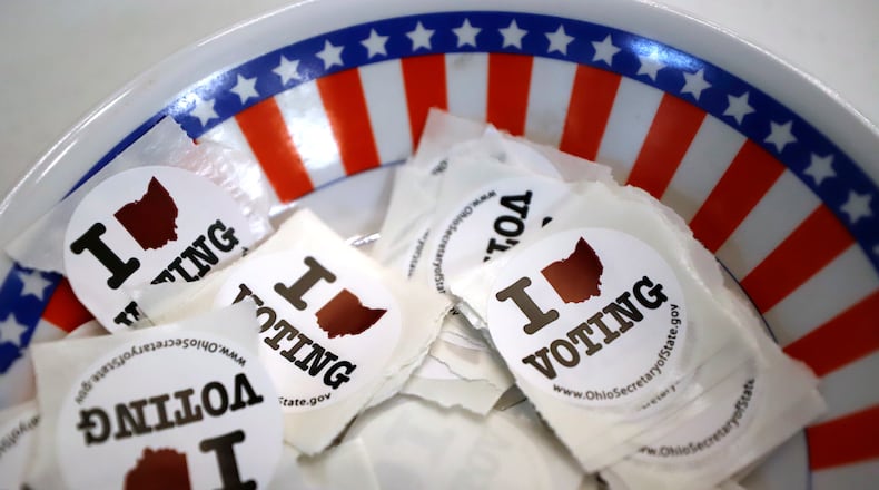 FILE - A bowl of voting stickers for early voters is shown March 15, 2020, in Steubenville, Ohio. (AP Photo/Gene J. Puskar, File)
