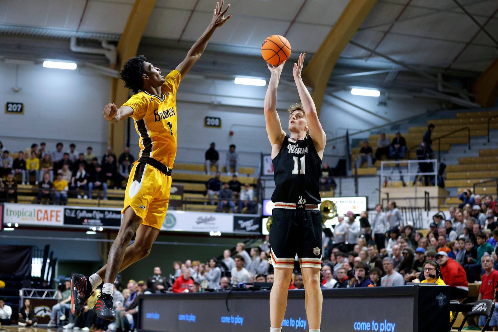 Miami (Ohio) forward Almar Atlason, right, shoots against Western Michigan guard Jayden Brewer, left, during the first half of an NCAA college basketball game, Friday, Feb. 27, 2026, in Kalamazoo, Mich. (AP Photo/Al Goldis)