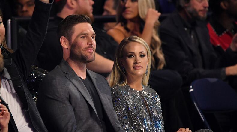 NASHVILLE, TN - JUNE 06: Mike Fisher and Carrie Underwood attend the 2018 CMT Music Awards at Bridgestone Arena on June 6, 2018 in Nashville, Tennessee. (Photo by Mike Coppola/Getty Images for CMT)