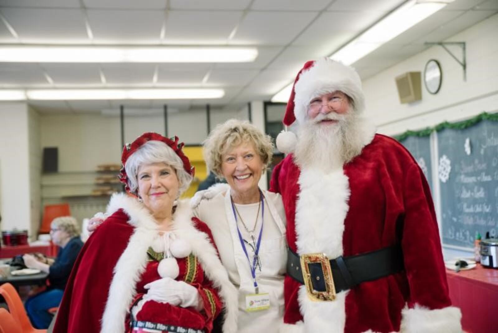 Santa and Mrs. Claus meet Kettering Arts Council member Sue Ellen Boesch.  A Rosewood Holiday Arts Festival  will be held Dec. 1. KNACK CREATIVE / SUBMITTED PHOTO