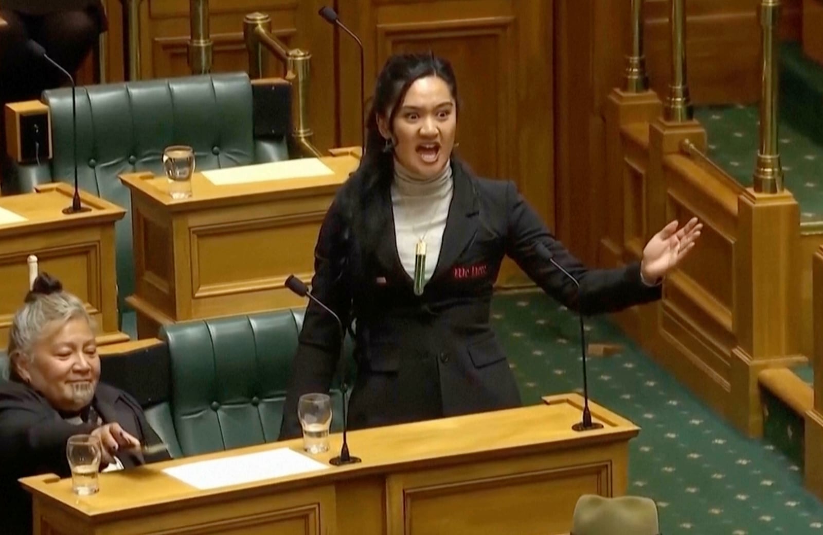 This image from May 15, 2025 video shows New Zealand lawmaker Hana-Rāwhiti Maipi-Clarke performing a Māori haka to protest a proposed law in Parliament, in Wellington, New Zealand, (New Zealand Parliament TV via AP)