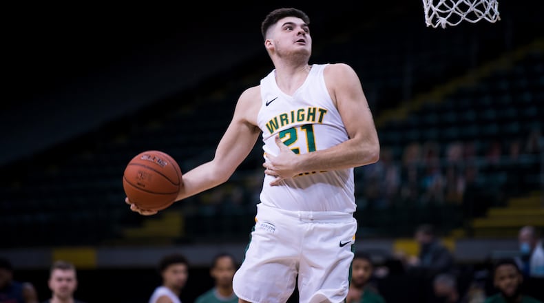 Wright State's Grant Basile goes up for a dunk during a game vs. Robert Morris at the Nutter Center on Friday, Jan. 29, 2021. Joseph Craven/Wright State Athletics