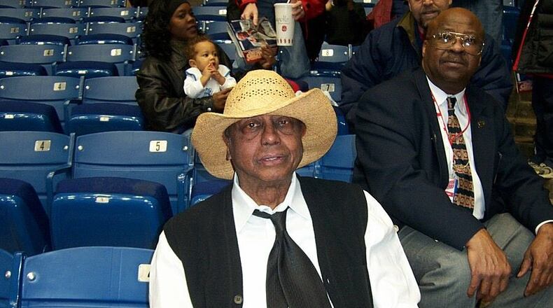 Temple coach John Chaney wears a straw hat given to him by Dayton students before a game at UD Arena on Feb. 27, 2002. Photo courtesy of Greg Popham II
