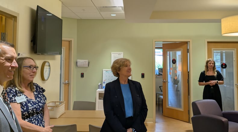 Dr. Judy Monroe, president and CEO of the CDC Foundation and a Dayton native, tours Brigid's Path, a newborn recovery center for babies exposed to addictive substances. SAM WILDOW/STAFF