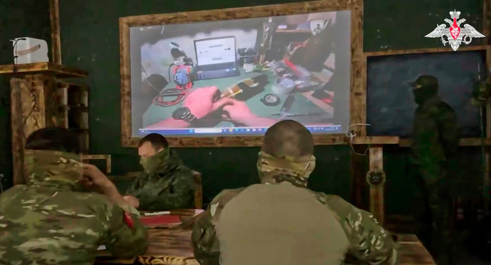 In this photo taken from video distributed by the Russian Defense Ministry Press Service on Monday, May 26, 2025, Russian serviceman train to work with military drones in an undisclosed location. (Russian Defense Ministry Press Service via AP)