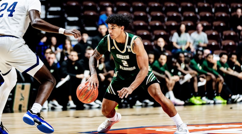 South Florida's Wes Enis, a Miami East graduate, dribbles against George Washington on Nov. 3, 2025, at the Yuengling Center in Tampa, Fla. Photo courtesy of South Florida