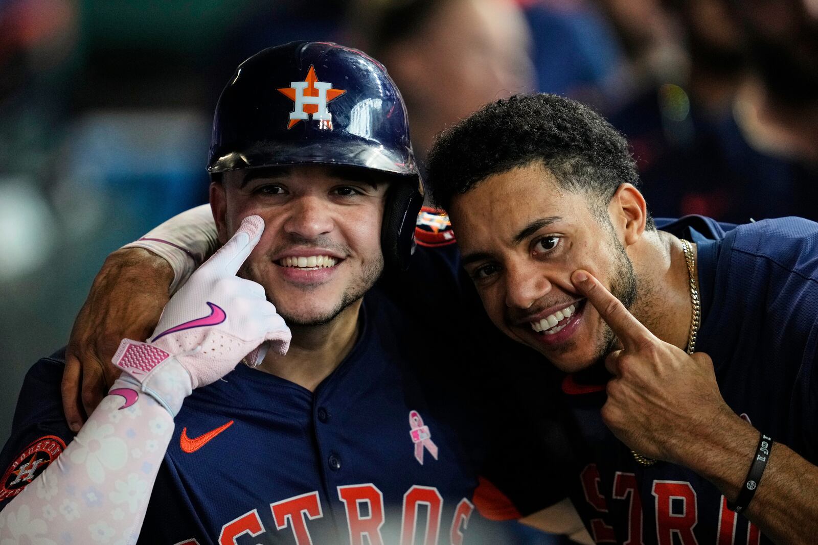 Houston Astros' Yainer Diaz, left, celebrates with Jeremy Pena after hitting a home run during the third inning of a baseball game against the Cincinnati Reds in Houston, Sunday, May 11, 2025. Isaac Paredes and Christian Walker also scored. (AP Photo/Ashley Landis)