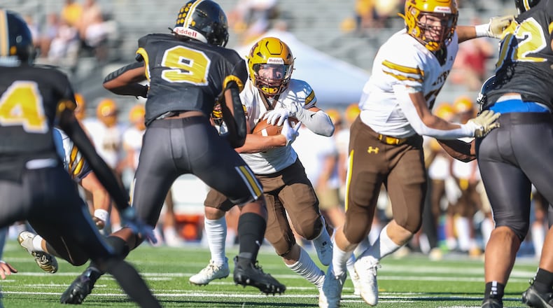 Alter High School sophomore Noah Jones runs the ball during their game against Meadowdale on Thursday, Aug. 31 at Dayton Welcome Stadium. CONTRIBUTED PHOTO BY MICHAEL COOPER