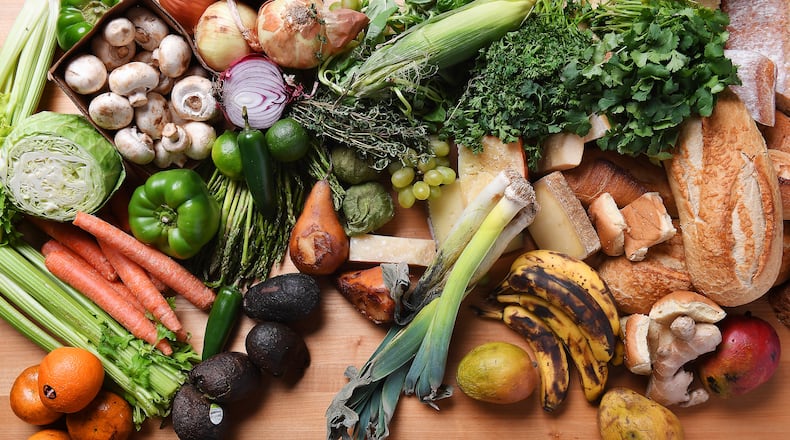 Americans waste about one pound of food per person per day, and they throw away trillions of gallons of water in the process. (Christina House/Los Angeles Times/TNS)