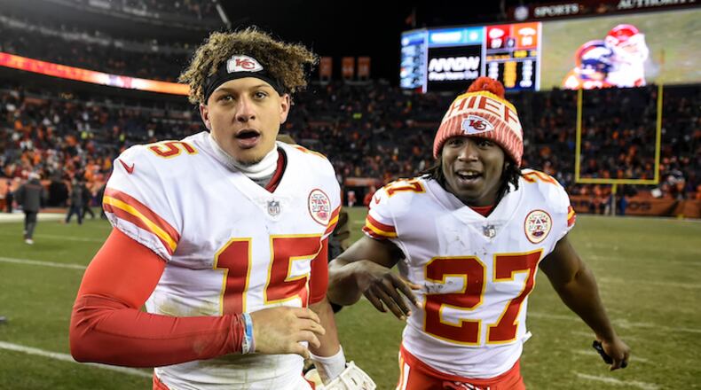 Kansas City Chiefs quarterback Patrick Mahomes (15) is congratulated by running back Kareem Hunt (27) after the Chiefs’ 27-24 win against the Denver Broncos on December 31, 2017, at Sports Authority Field in Denver. (David Eulitt/Kansas City Star/TNS)