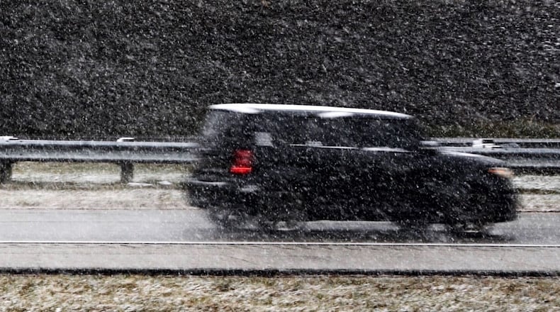 Snow is starting to stick to the ground in Greene County near Jamestown. STAFF FILE