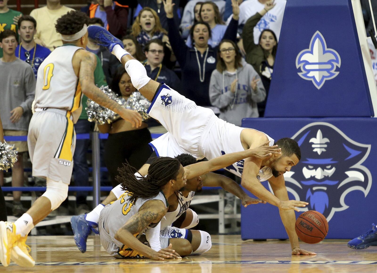 New Orleans Privateers forward Erik Thomas (14) is upended going for a rebound during the game between Southeastern and UNO at Lakefront Arena on Thursday, March 2, 2017. (Michael DeMocker/NOLA.com The Times-Picayune via AP)