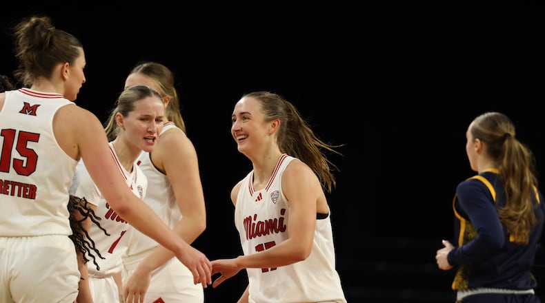 Miami's Nuria Jurjo walks off the court during a timeout against Toledo on Saturday at Millett Hall. ELIJAH COOK / CONTRIBUTED
