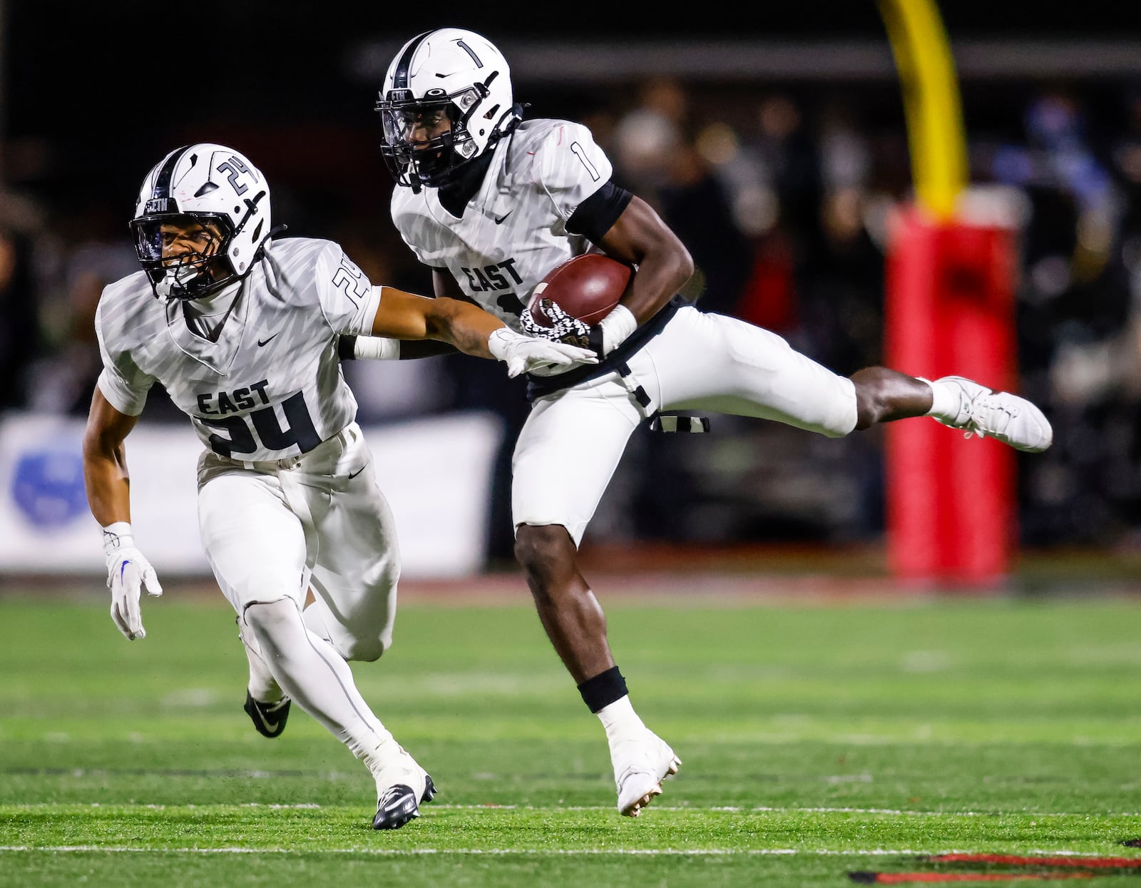 Lakota East's Ryder Hooks blocks for teammate Zion Neal carries during their football game against Lakota West Friday, Oct. 18, 2024 at Lakota West High School in West Chester Township. Lakota West Won 42-24. NICK GRAHAM/STAFF