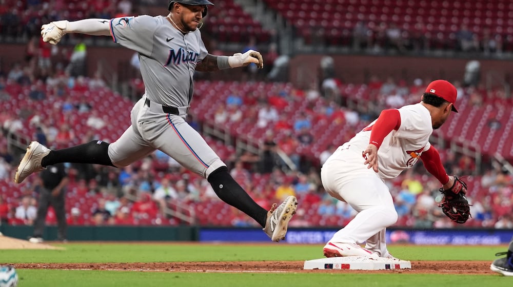 Miami Marlins' Dane Myers, left, grounds out as St. Louis Cardinals first baseman Willson Contreras handles the throw during the sixth inning of a baseball game Monday, July 28, 2025, in St. Louis. (AP Photo/Jeff Roberson)