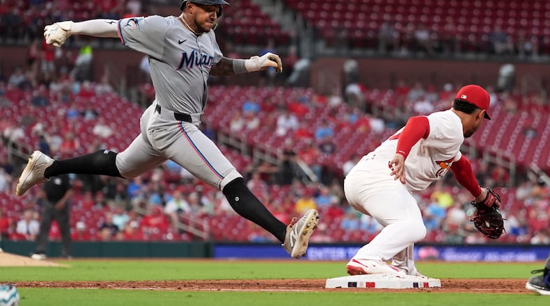 Miami Marlins' Dane Myers, left, grounds out as St. Louis Cardinals first baseman Willson Contreras handles the throw during the sixth inning of a baseball game Monday, July 28, 2025, in St. Louis. (AP Photo/Jeff Roberson)