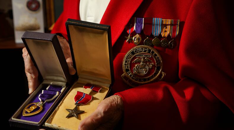 DETAIL: Jack Daugherty, a former Marine who was a medic at Iwo Jima and Guam in World War II with the medals he earned, the Bronze Star and Purple Heart. JIM WITMER/STAFF
