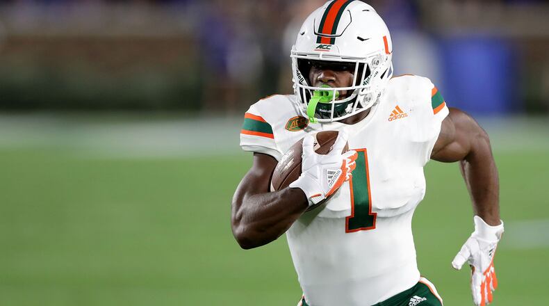 DURHAM, NC - SEPTEMBER 29: Mark Walton #1 of the Miami Hurricanes runs with the ball against the Duke Blue Devils during their game at Wallace Wade Stadium on September 29, 2017 in Durham, North Carolina. (Photo by Streeter Lecka/Getty Images)