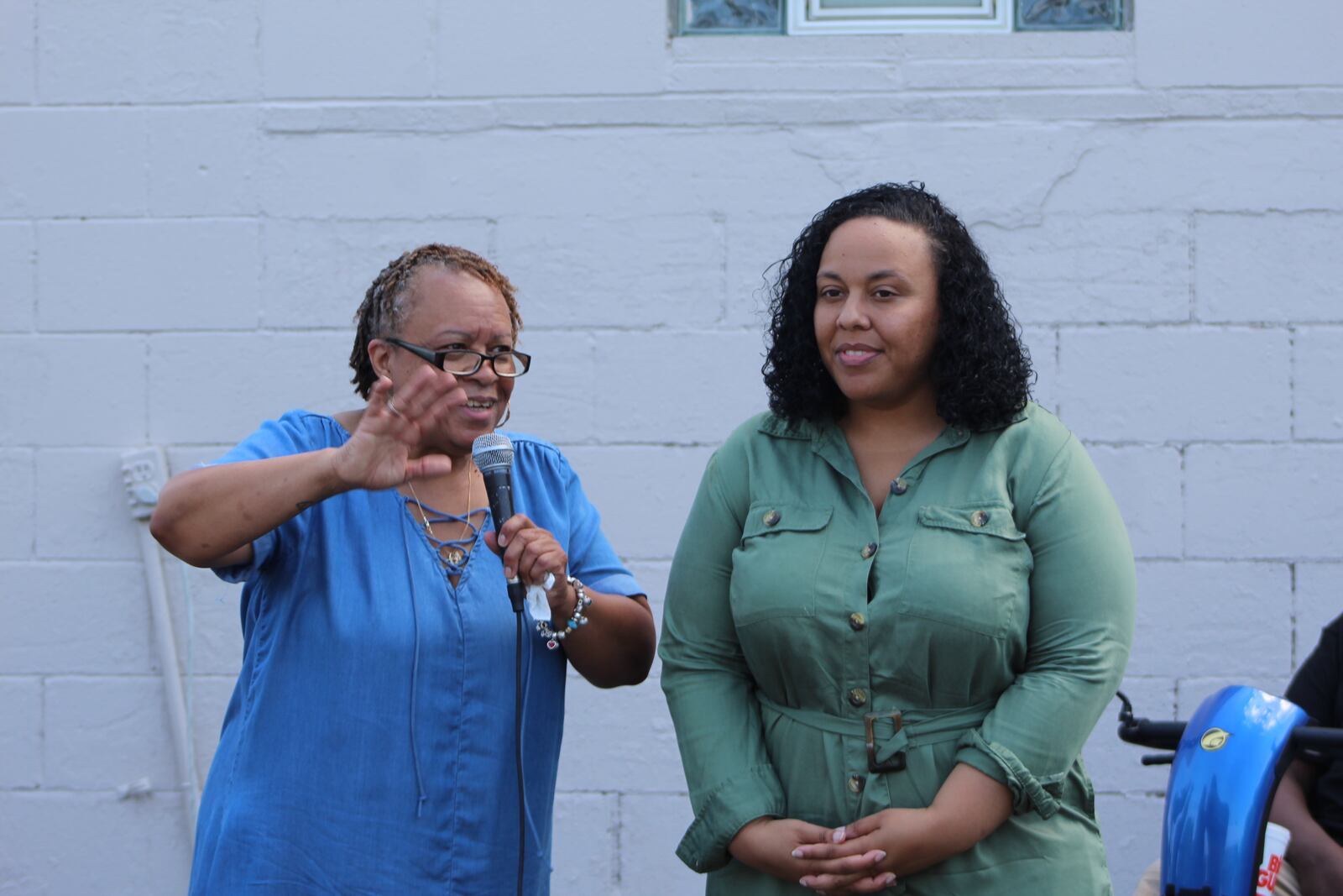 Robbie Brandon, director of the new Healthy Family Market, and co-director Alexandra Carpenter, at an event Friday at the project site on the 2100 block of Germantown Street in West Dayton. CORNELIUS FROLIK / STAFF