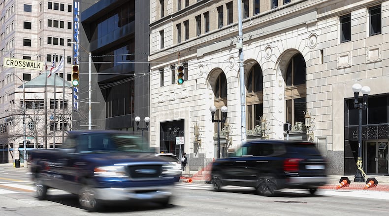 Main Street between East Second Street and East Third Street was reopened to traffic on Friday. The road had been closed since bricks from the building at 34 N. Main St. fell during high winds on Saturday, some of which struck Stratacache Tower and caused damage. The sidewalk in front of 34 N. Main St. continues to be closed while crews work on the building. BRYANT BILLING / STAFF
