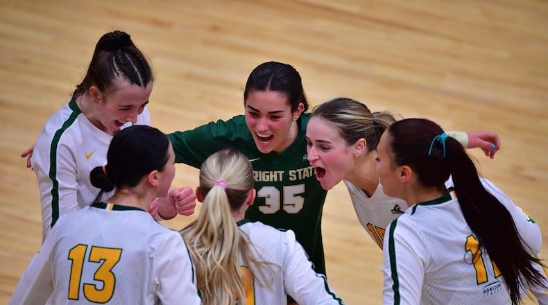 Wright State players celebrate a winning point against Green Bay in the Horizon League championship match at McLin Gymnasium on Nov. 19, 2023. Wright State Athletics photo