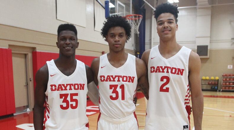 Dayton’s Dwayne Cohill, Jhery Matos and Frankie Policelli pose for a photo on Wednesday, Oct. 18, 2018, at the Cronin Center. David Jablonski/Staff