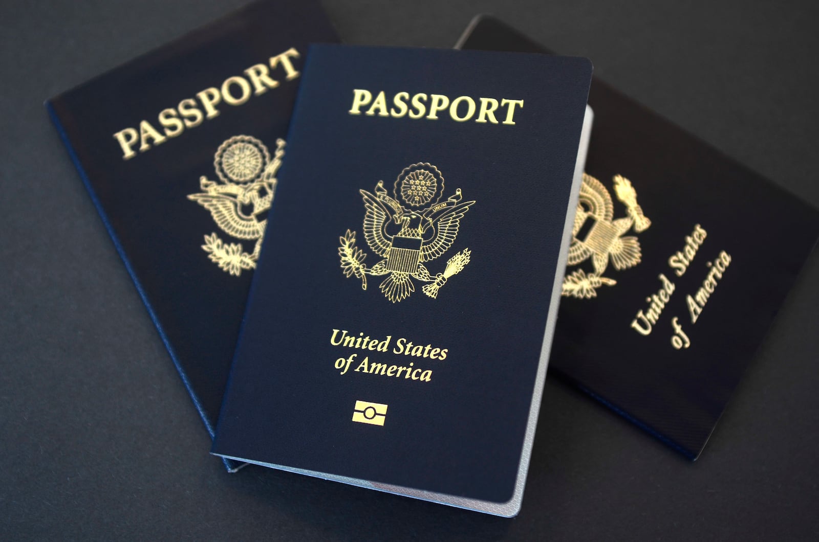 In this May 9, 2017, file photo, U.S. passports lie on a table in Dallas. (AP Photo/Benny Snyder, File)