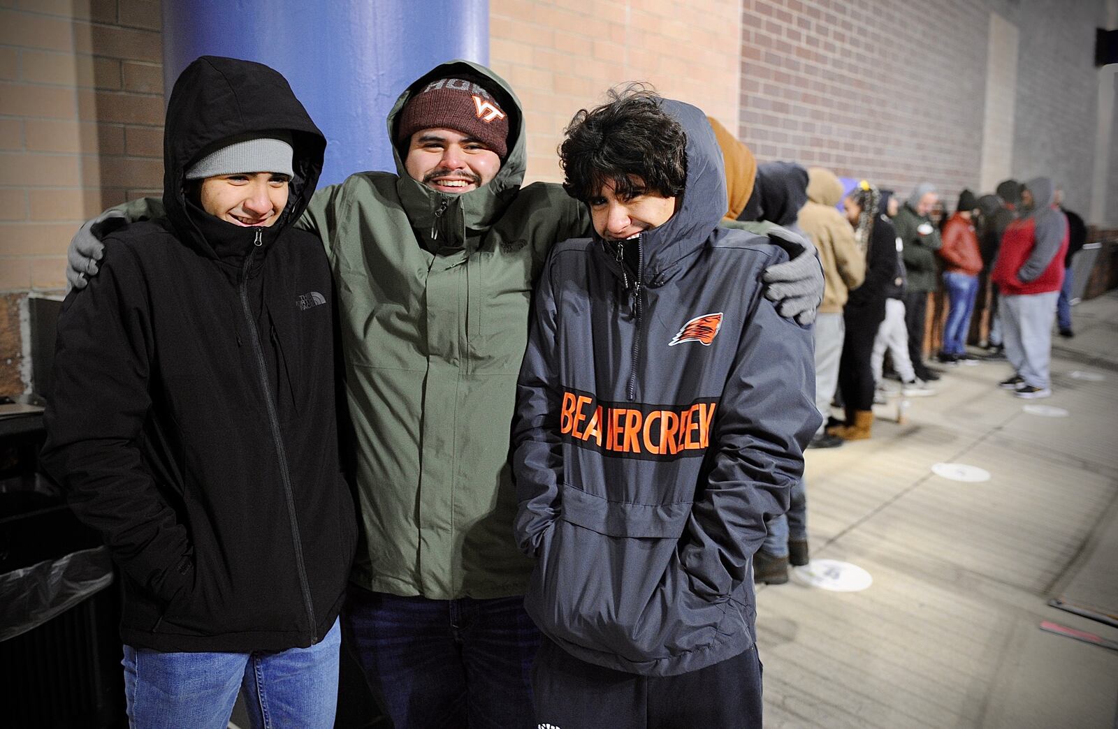 From left, Nathan Padilla, Alexander Padilla and Andrew Padilla were first in line at the Best Buy in Beavercreek, Friday Nov. 26, 2021. MARSHALL GORBY \STAFF