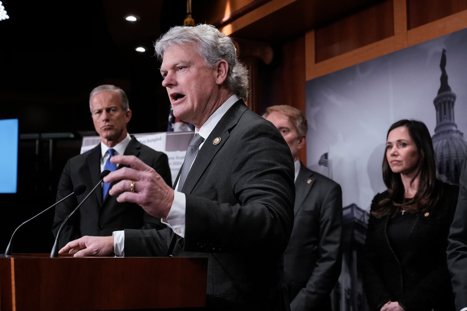 FILE - Rep. Mike Collins, R-Ga., center,, is joined from left by Senate Majority Leader John Thune, R-S.D., Sen. James Lankford, R-Okla., and Sen. Katie Britt, R-Ala., as they talk to reporters about the Laken Riley Act, a bill to detain unauthorized immigrants who have been accused of certain crimes, at the Capitol in Washington, Jan. 9, 2025. (AP Photo/J. Scott Applewhite, File)