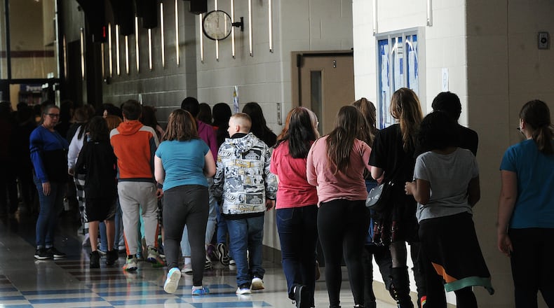 File - Students at Miamisburg Middle School walk through the hallways on May 5, 2022. Montgomery County will be expanding its access to intensive home-based behavioral health treatment for children after the Ohio Department of Medicaid announced additional grant funding in May 2024. This type of treatment helps children in settings they are familiar with, such as home or school, to treat mental or emotional health problems that are disrupting their day-to-day functioning. MARSHALL GORBY\STAFF FILE