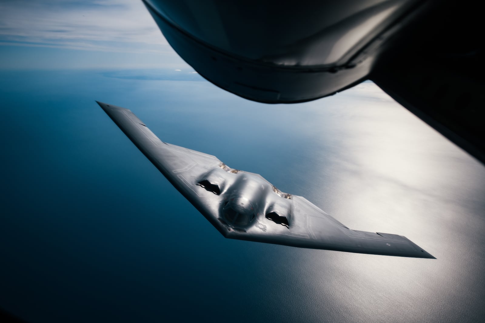 An Air Force 509th Bomb Wing B-2 Spirit approaches a 351st Aerial Refueling Squadron KC-135 Stratotanker during a training exercise over England in 2019. U.S. Air Force photo by Staff Sgt. Jordan Castelan