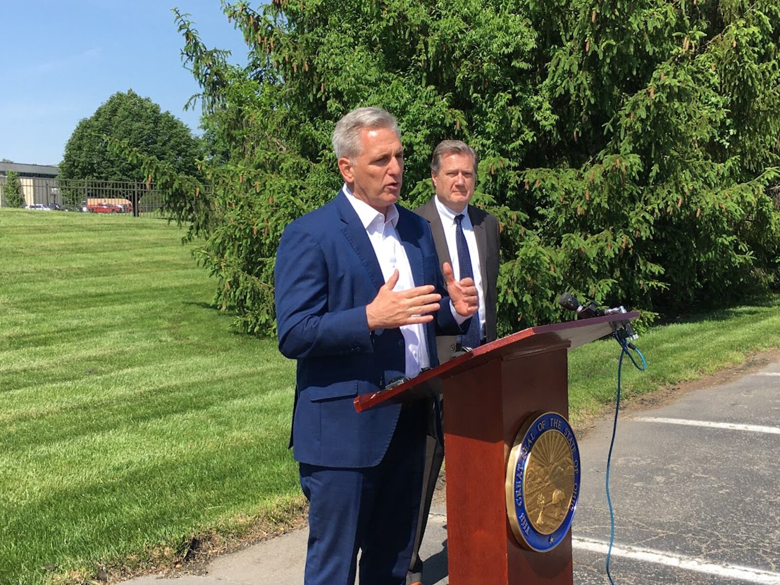 House GOP Leader Kevin McCarthy, at the podium, with U.S. Rep. Mike Turner, R-Dayton, in May 2022 at the Hope Hotel, Wright-Patterson Air Force Base. THOMAS GNAU/STAFF