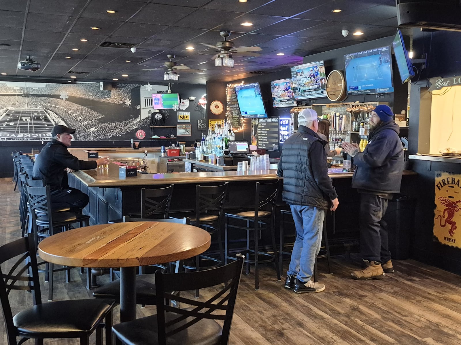 While the Super Bowl means a bump in business for stores dealing in carry-out and catering, places like Mr. Boro's Tavern don't see any extra revenue from the big game. MICHAEL KURTZ / STAFF