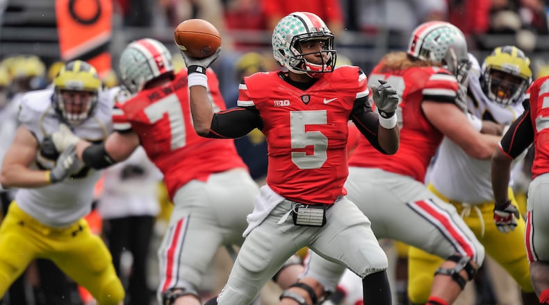 COLUMBUS, OH - NOVEMBER 24: Quarterback Braxton Miller #5 of the Ohio State Buckeyes controls the ball against the Michigan Wolverines at Ohio Stadium on November 24, 2012 in Columbus, Ohio. (Photo by Jamie Sabau/Getty Images)