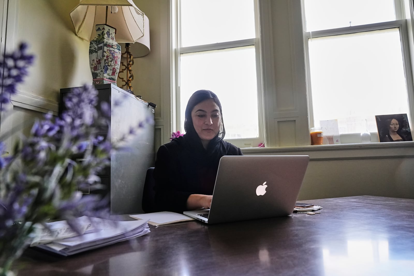 Negina Khalili works in her office in New Orleans, Thursday, May 1, 2025. (AP Photo/Gerald Herbert)